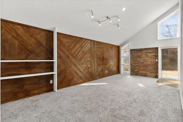 a view of an empty room with a ceiling fan