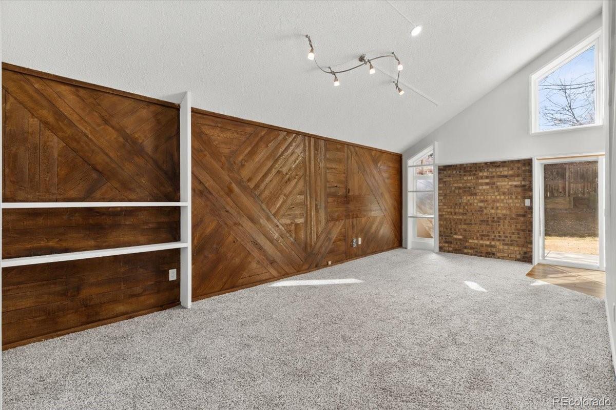 16222 East Rice Place, Unit B Aurora, CO 80015 - Photo 6 of 31 a view of an empty room with a ceiling fan