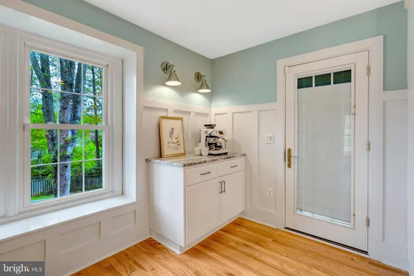 a view of kitchen with wooden floor and window