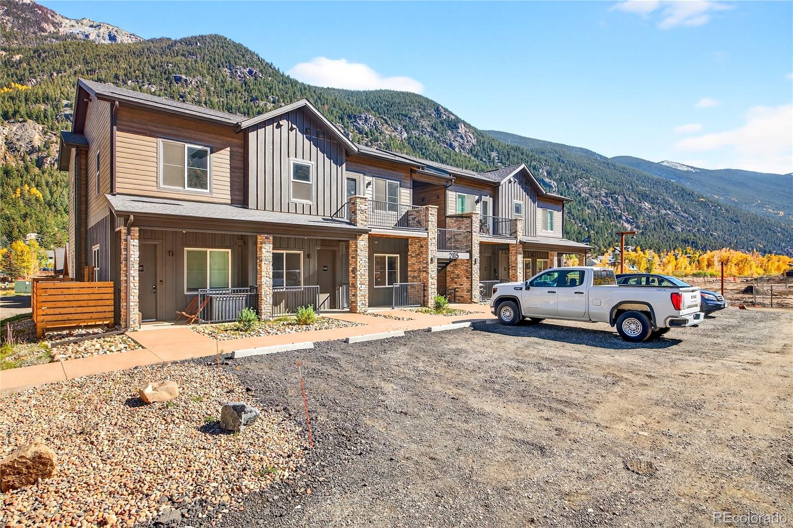 2155 Bighorn Road, Unit 101 Georgetown, CO 80444 - Photo 16 of 35 a view of a car park in front of a building