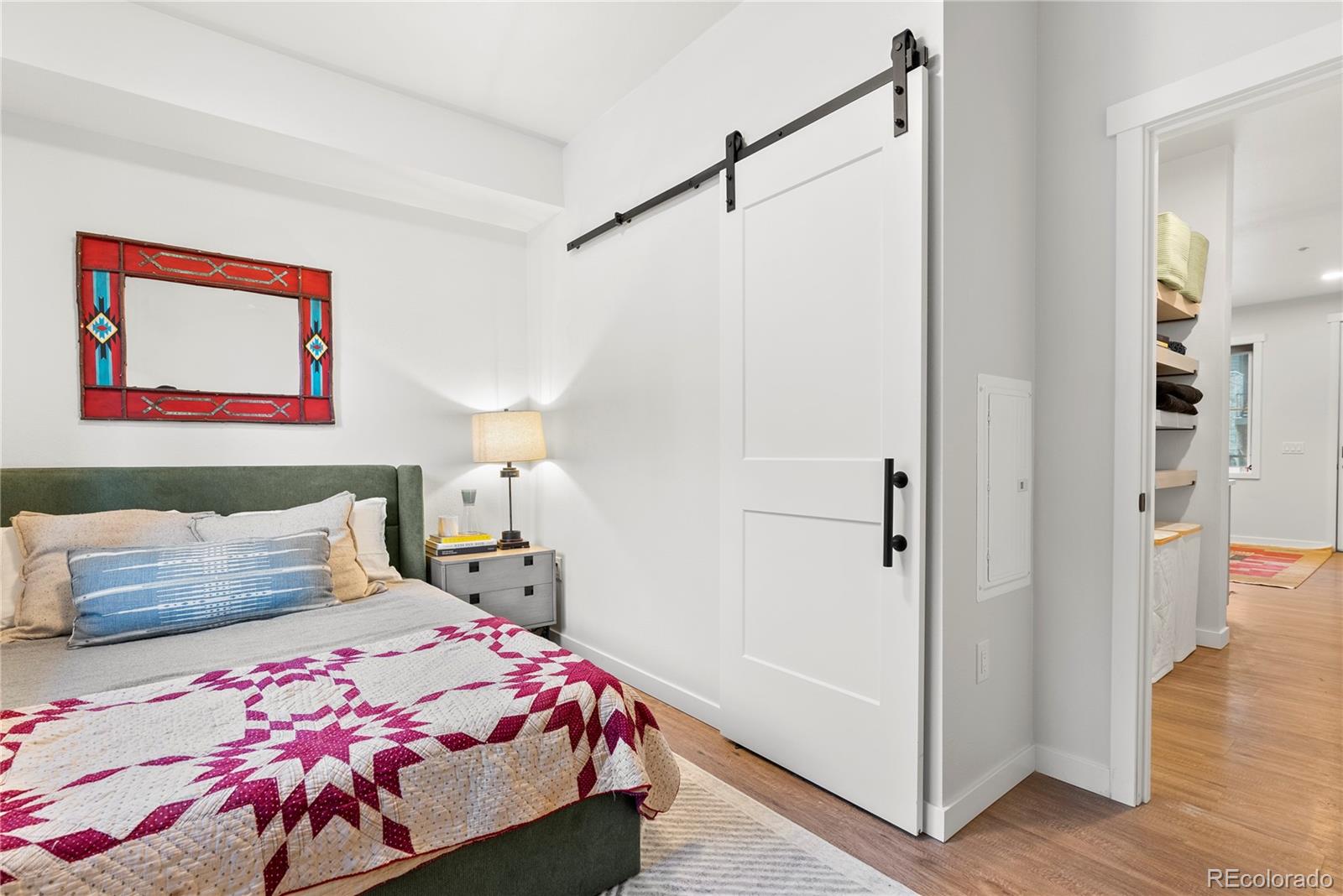 2155 Bighorn Road, Unit 101 Georgetown, CO 80444 - Photo 8 of 35 a bedroom with a bed and a painting on the wall