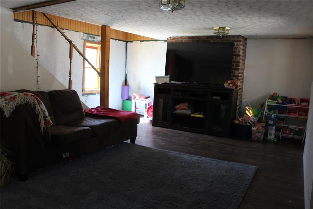 283 Duck Hollow Road Uniontown, PA 15401 - Photo 20 of 38 a living room with furniture and a fireplace