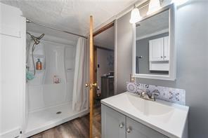 283 Duck Hollow Road Uniontown, PA 15401 - Photo 26 of 38 a bathroom with a sink mirror and shower