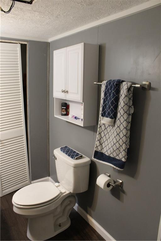 283 Duck Hollow Road Uniontown, PA 15401 - Photo 27 of 38 a white toilet sitting next to a bathroom sink