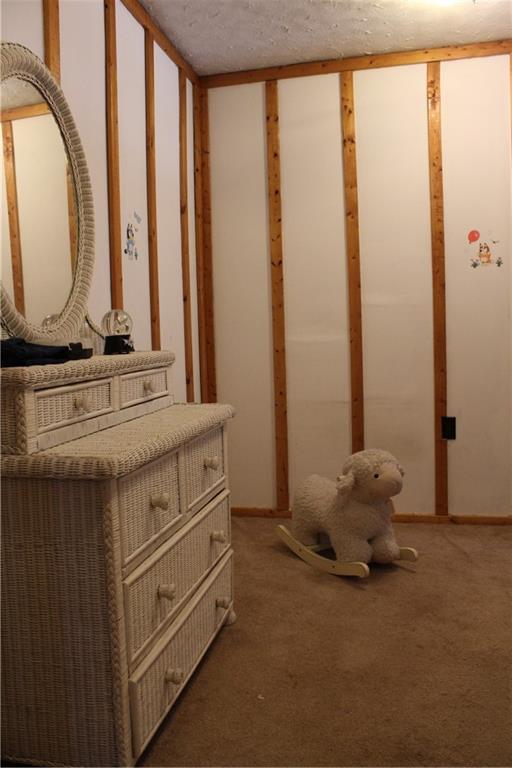 283 Duck Hollow Road Uniontown, PA 15401 - Photo 32 of 38 a room with a bed and large windows
