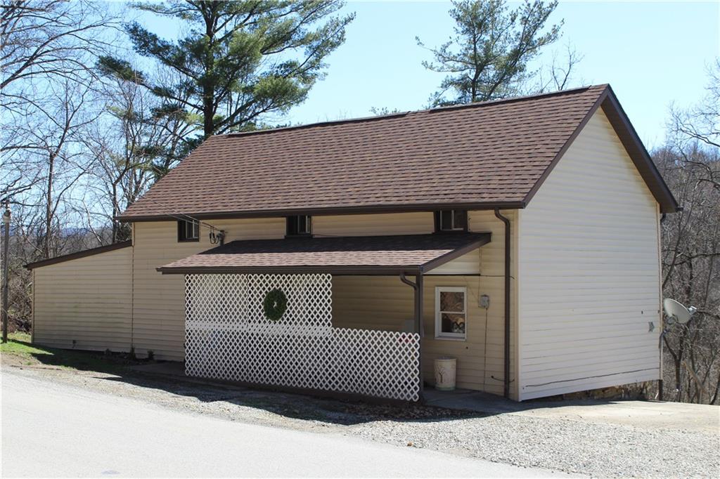 283 Duck Hollow Road Uniontown, PA 15401 - Photo 4 of 38 a front view of a house with a yard