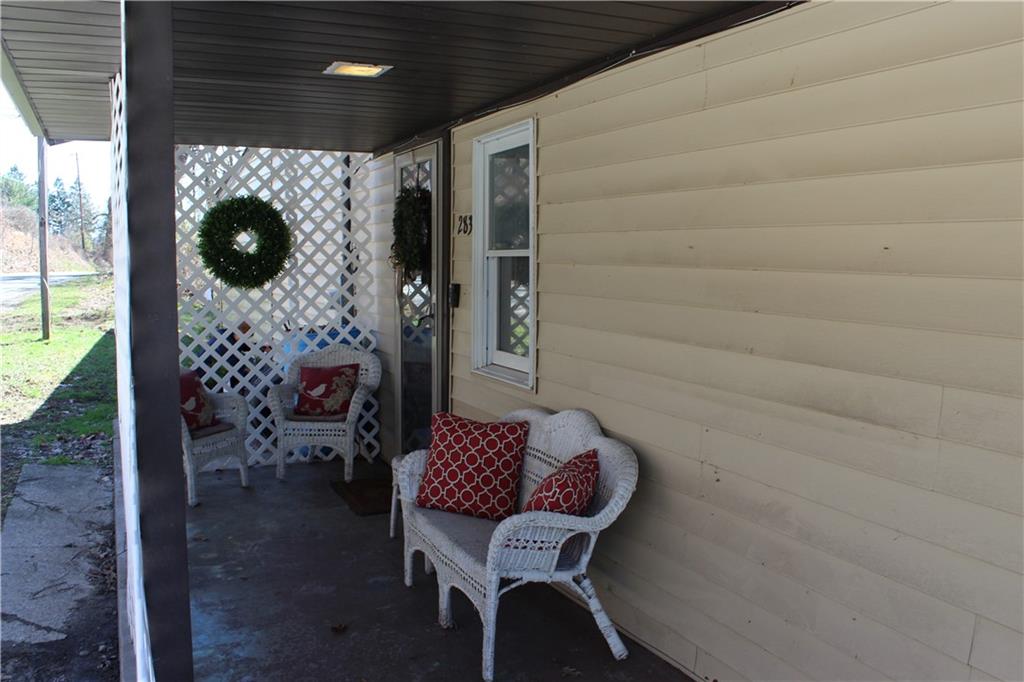 283 Duck Hollow Road Uniontown, PA 15401 - Photo 7 of 38 a balcony with table and chairs