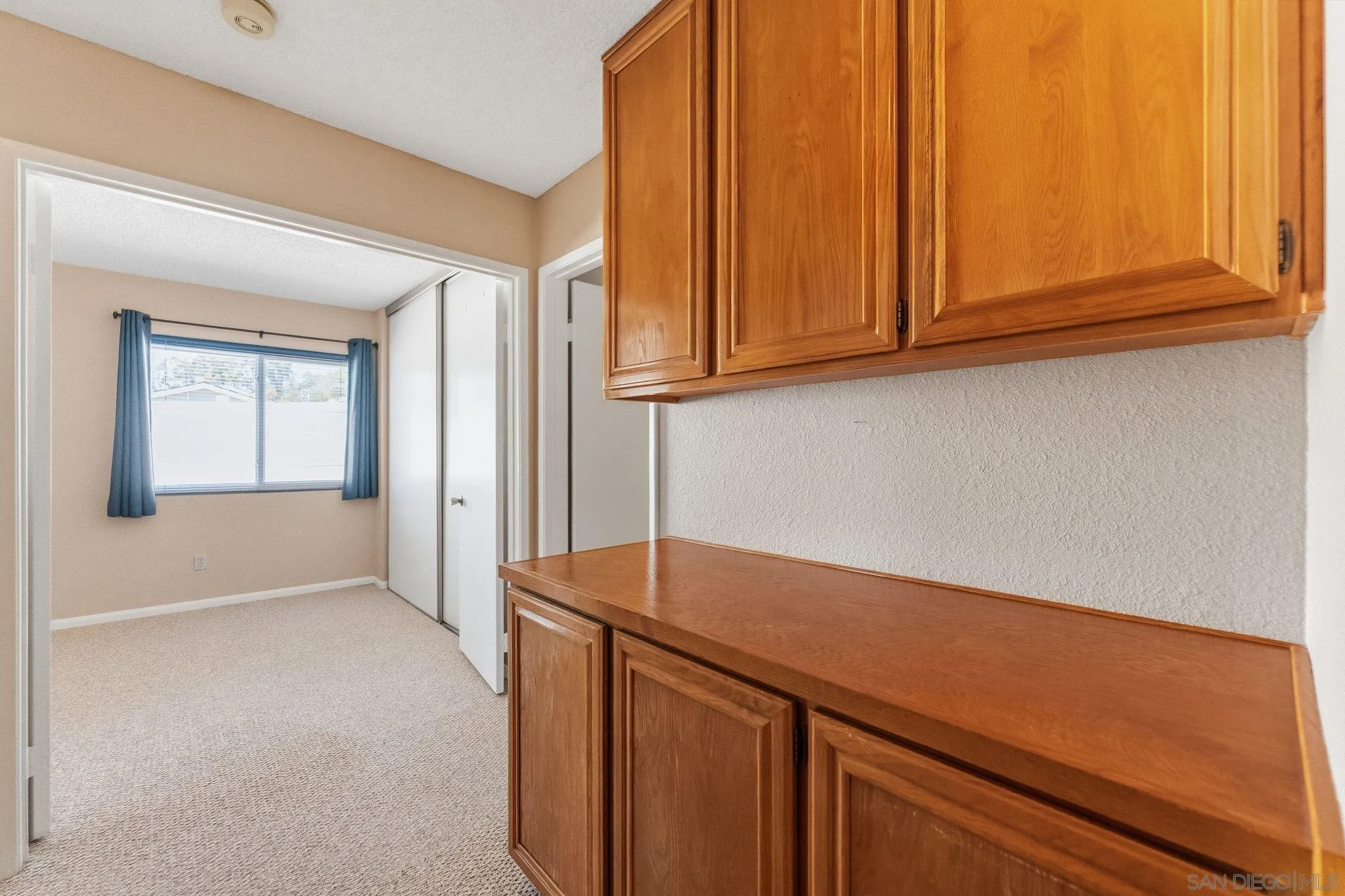10565 Strathmore Drive Santee, CA 92071 - Photo 37 of 59 a kitchen with a sink and cabinets