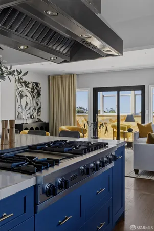 a stove top oven sitting inside of a kitchen