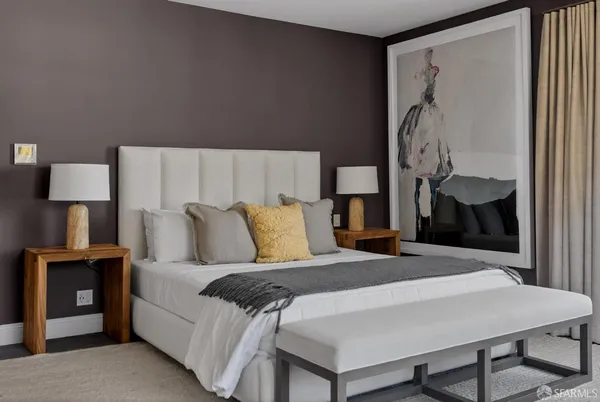 a bedroom with a bed and a table in it