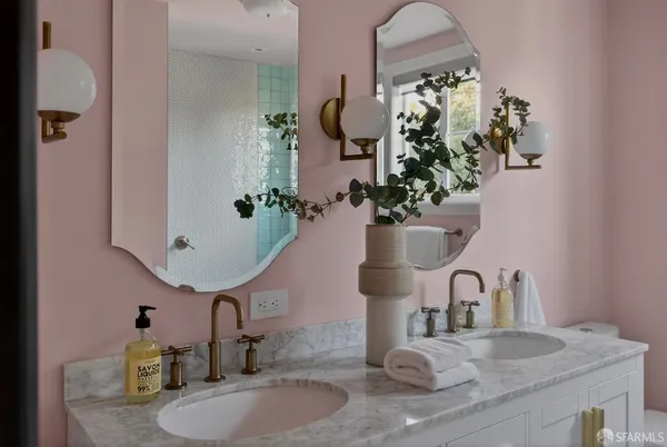 a bathroom with sink and mirror