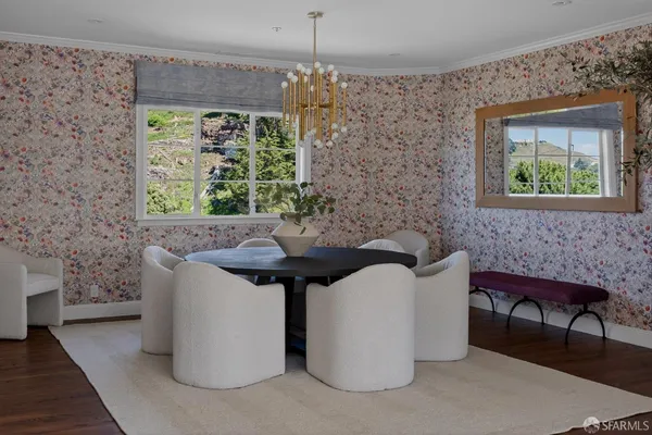 a bath room with a table and chairs