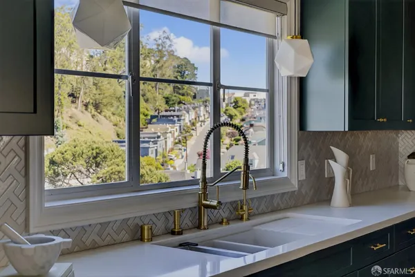 a kitchen with a sink and a window