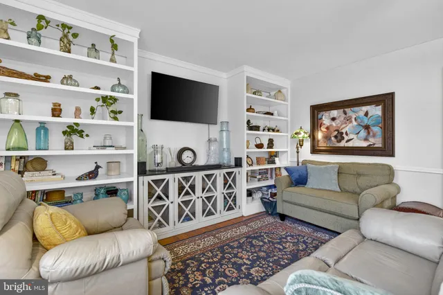 a kitchen with stainless steel appliances granite countertop a refrigerator a stove a sink and a refrigerator