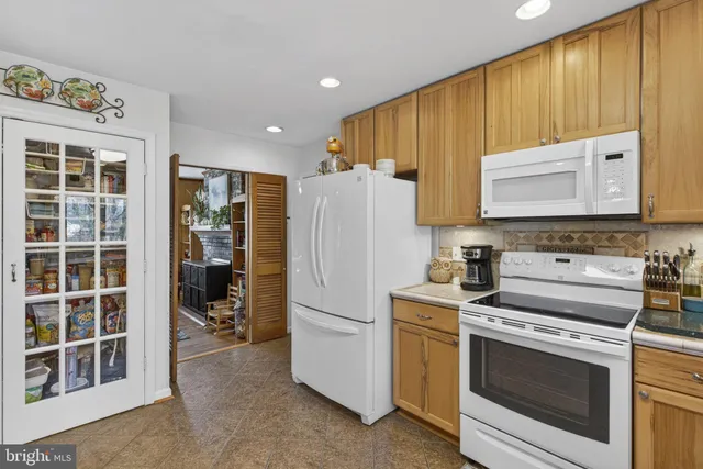 a kitchen with sink cabinets and window