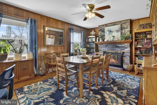 a bedroom with a bed and painting on the wall