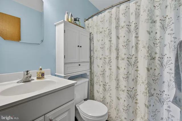 a room with a bed and flat screen tv