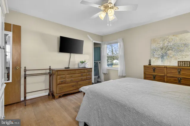 a living room with furniture and a bookshelf