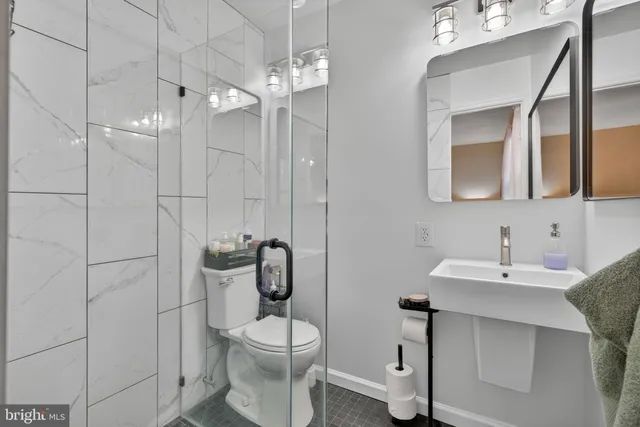 a view of living room with furniture and a floor to ceiling window