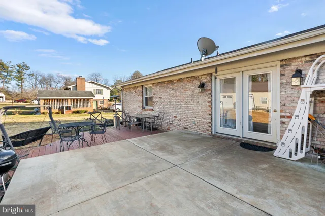 a view of a chairs and table on the deck