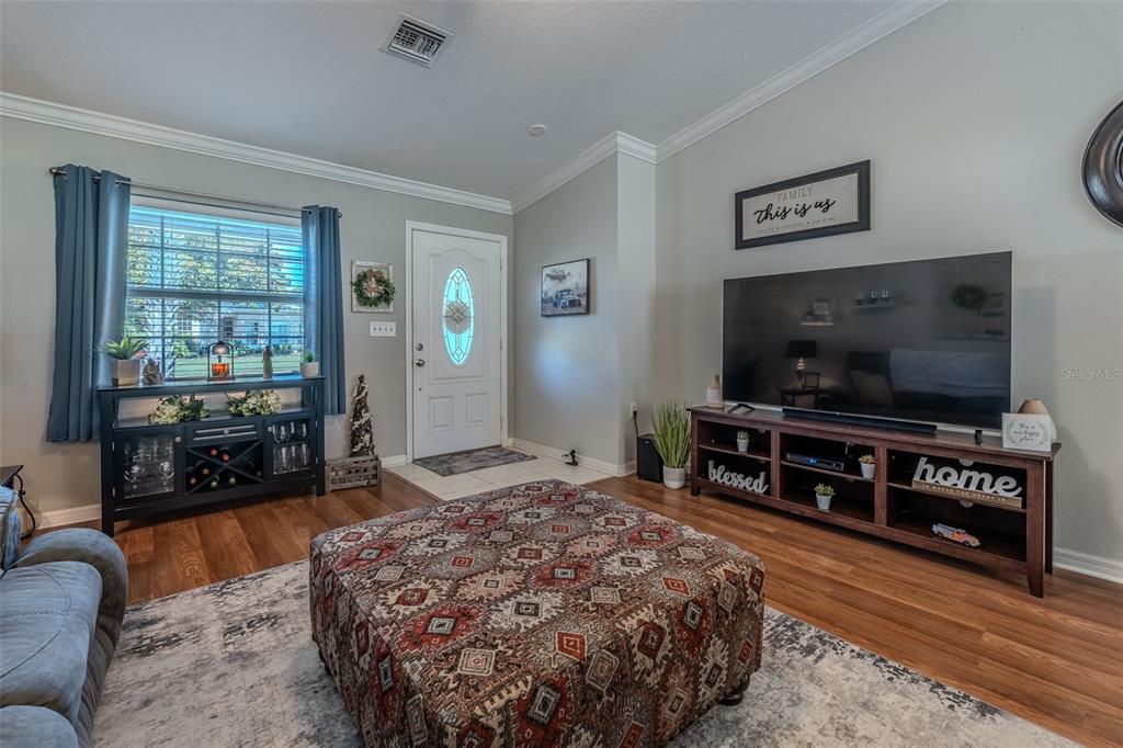15143 Southwest 14th Avenue Road Ocala, FL 34473 - Photo 7 of 53 a living room with furniture and a flat screen tv