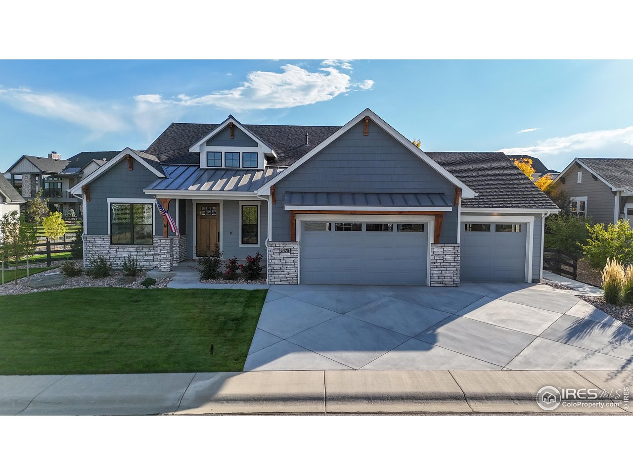 6475 Sanctuary Drive Windsor, CO 80550 - Photo 1 of 37 a house view with a garden space