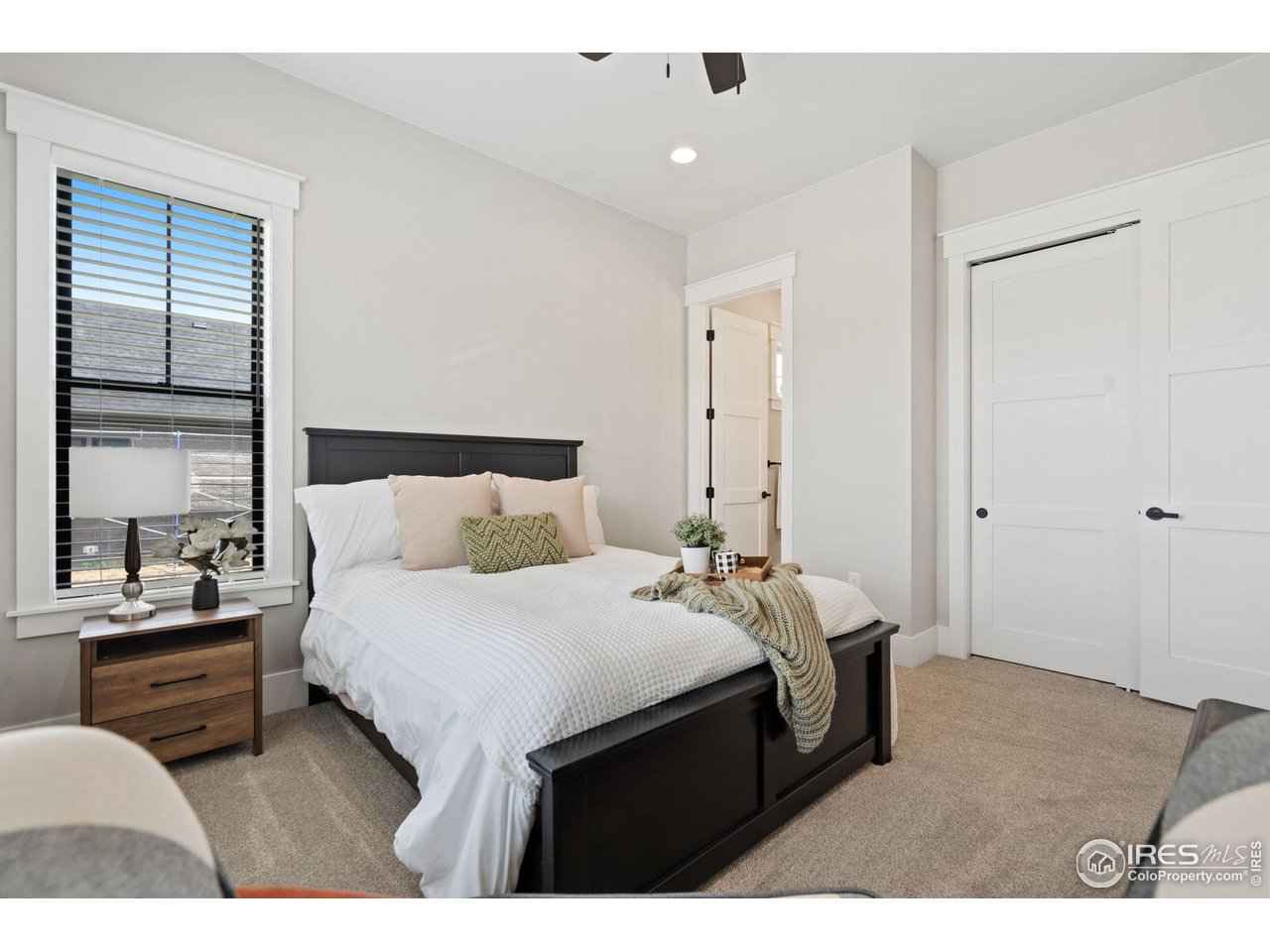 6475 Sanctuary Drive Windsor, CO 80550 - Photo 12 of 37 a bedroom with a bed and window