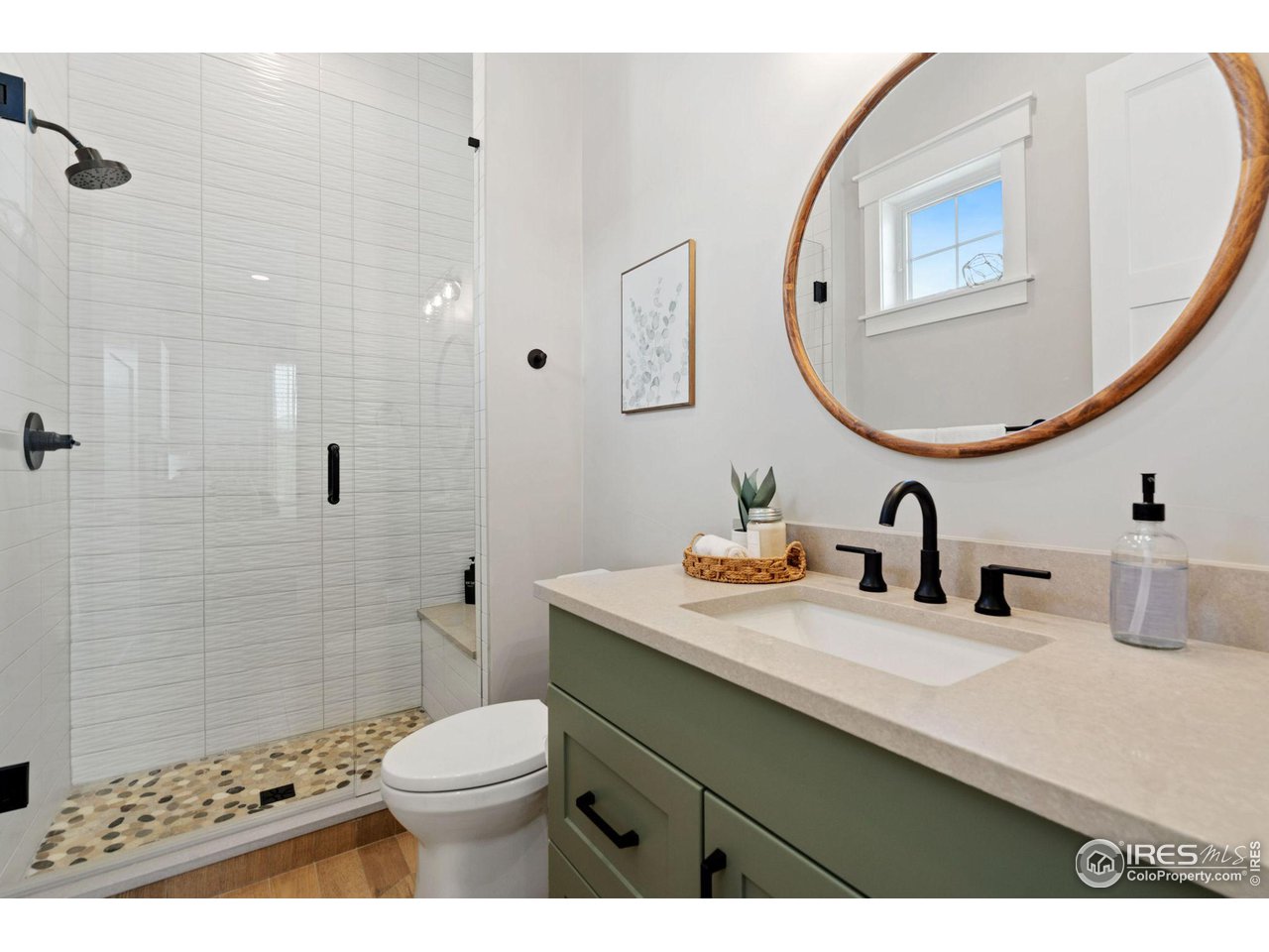 6475 Sanctuary Drive Windsor, CO 80550 - Photo 13 of 37 a bathroom with a sink a toilet and a mirror