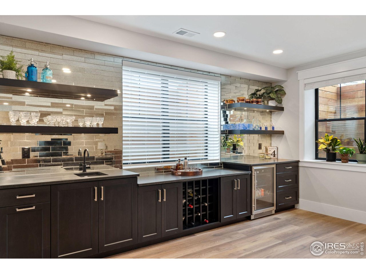 6475 Sanctuary Drive Windsor, CO 80550 - Photo 22 of 37 a kitchen with a sink and cabinets