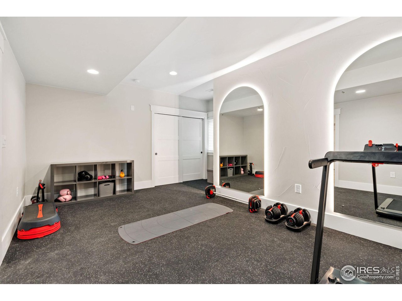 6475 Sanctuary Drive Windsor, CO 80550 - Photo 24 of 37 a living room with furniture and a flat screen tv
