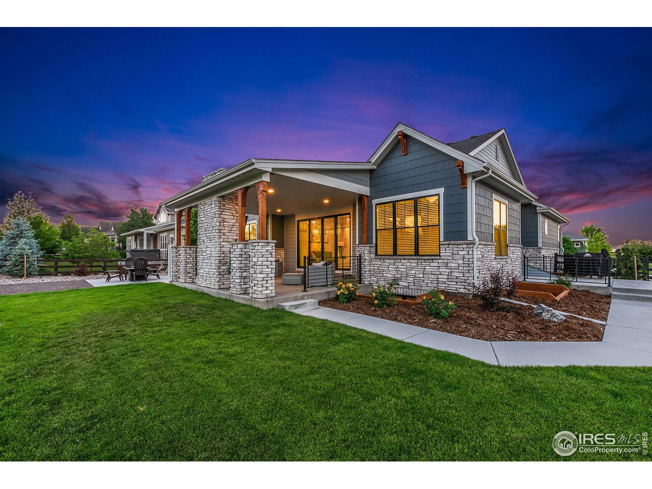 6475 Sanctuary Drive Windsor, CO 80550 - Photo 31 of 37 a front view of a house with a yard