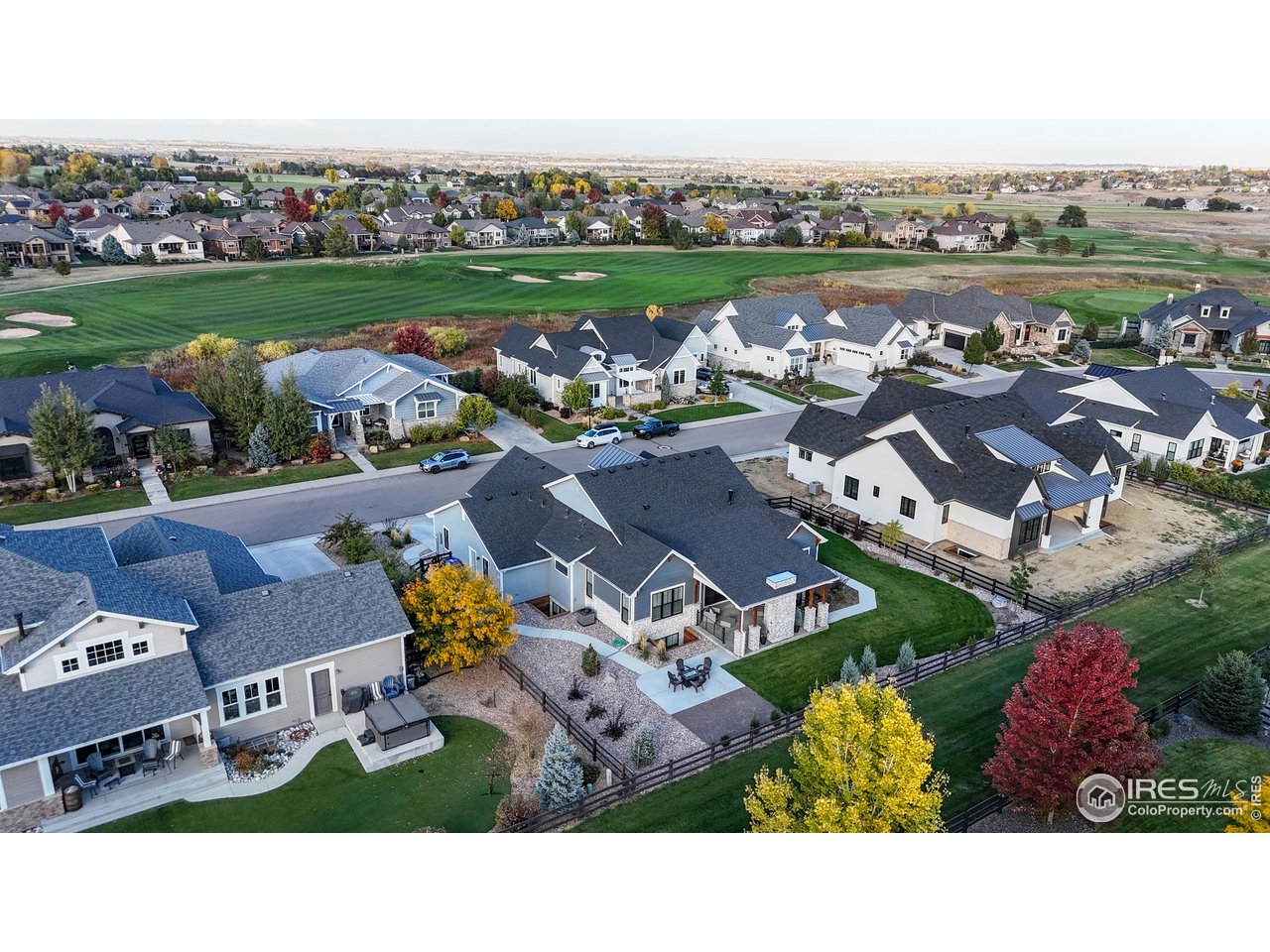 6475 Sanctuary Drive Windsor, CO 80550 - Photo 34 of 37 an aerial view of a house with a garden and lake view