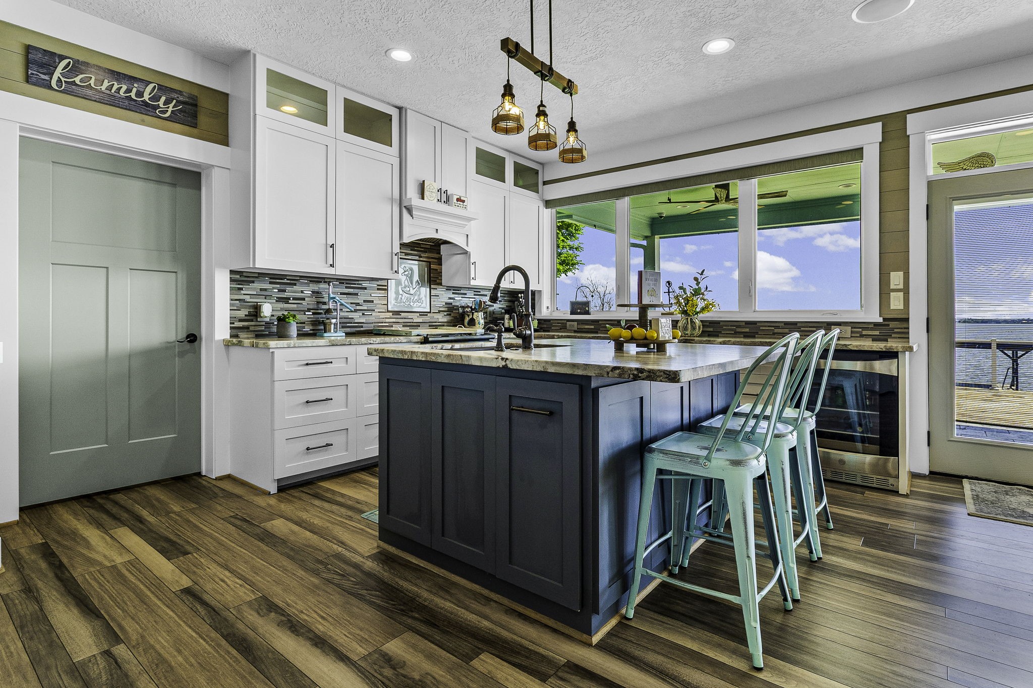 151 Key Largo Loop Point Blank, TX 77364 - Photo 12 of 49 Entertain with ease in this stunning kitchen featuring an oversized island, custom finishes, and spectacular water views.