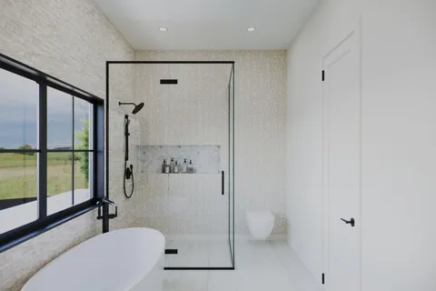 a bathroom with a toilet a sink and shower