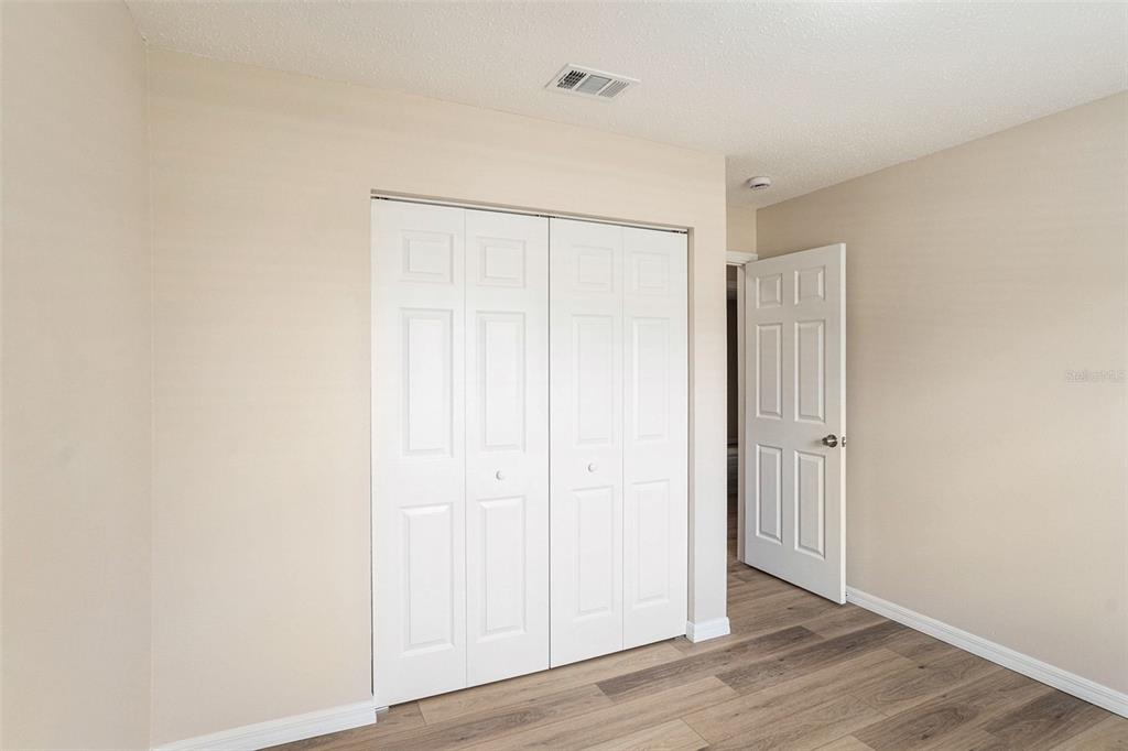 2527 Ridge Top Way Valrico, FL 33594 - Photo 16 of 29 an empty room with wooden floor