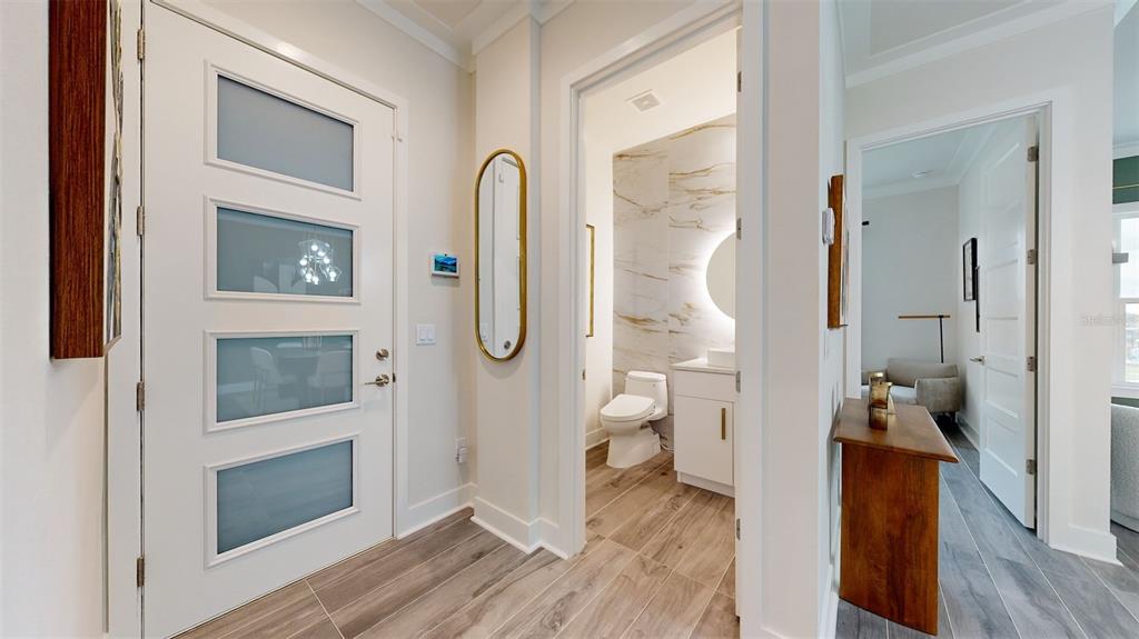 772 Gran Kaymen Way Apollo Beach, FL 33572 - Photo 13 of 43 a view of a bathroom from the hallway