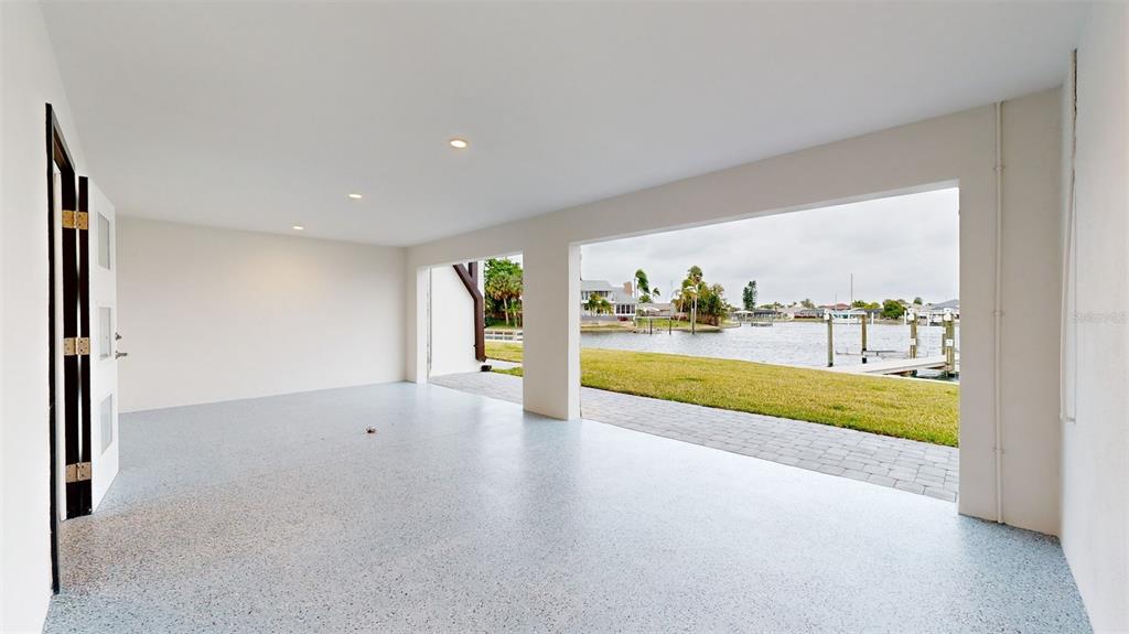 772 Gran Kaymen Way Apollo Beach, FL 33572 - Photo 31 of 43 wooden floor in an empty room with a window