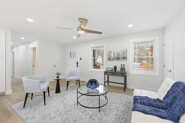 a living room with furniture and a large window