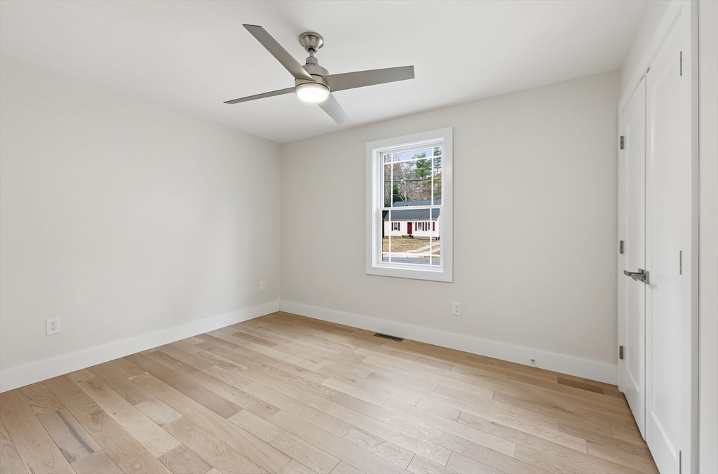 46 Horseshoe Circle Ware, MA 01082 - Photo 22 of 36 an empty room with a window and ceiling fan
