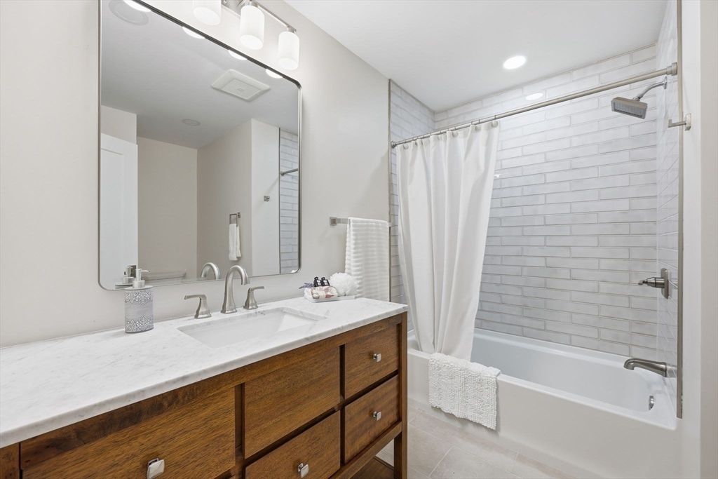 46 Horseshoe Circle Ware, MA 01082 - Photo 24 of 36 a bathroom with a shower sink vanity and mirror