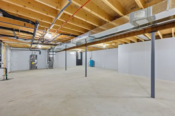 a view of empty room with wooden walls