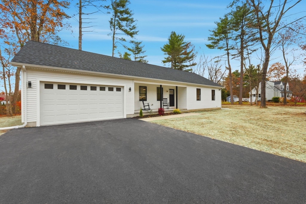 46 Horseshoe Circle Ware, MA 01082 - Photo 3 of 36 a front view of a house with a yard and garage