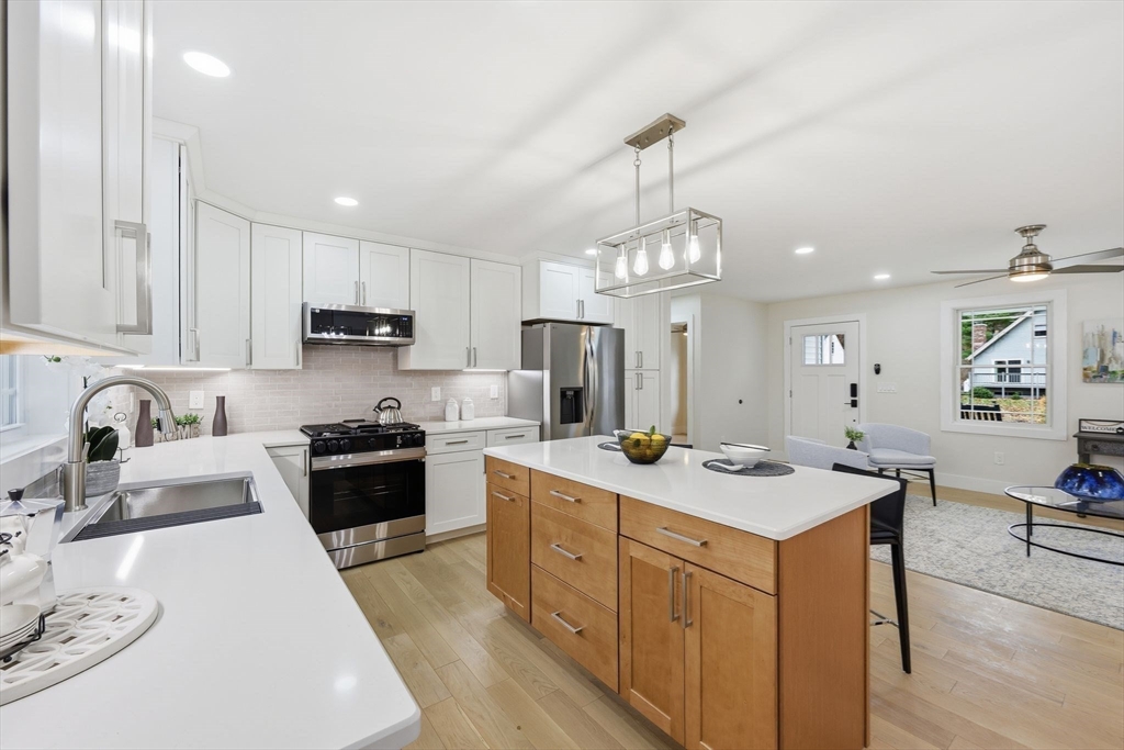 46 Horseshoe Circle Ware, MA 01082 - Photo 5 of 36 a open kitchen with stainless steel appliances granite countertop a sink stove and refrigerator