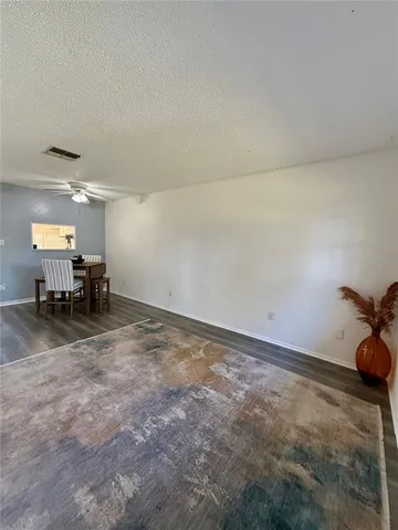 a view of a livingroom and a window