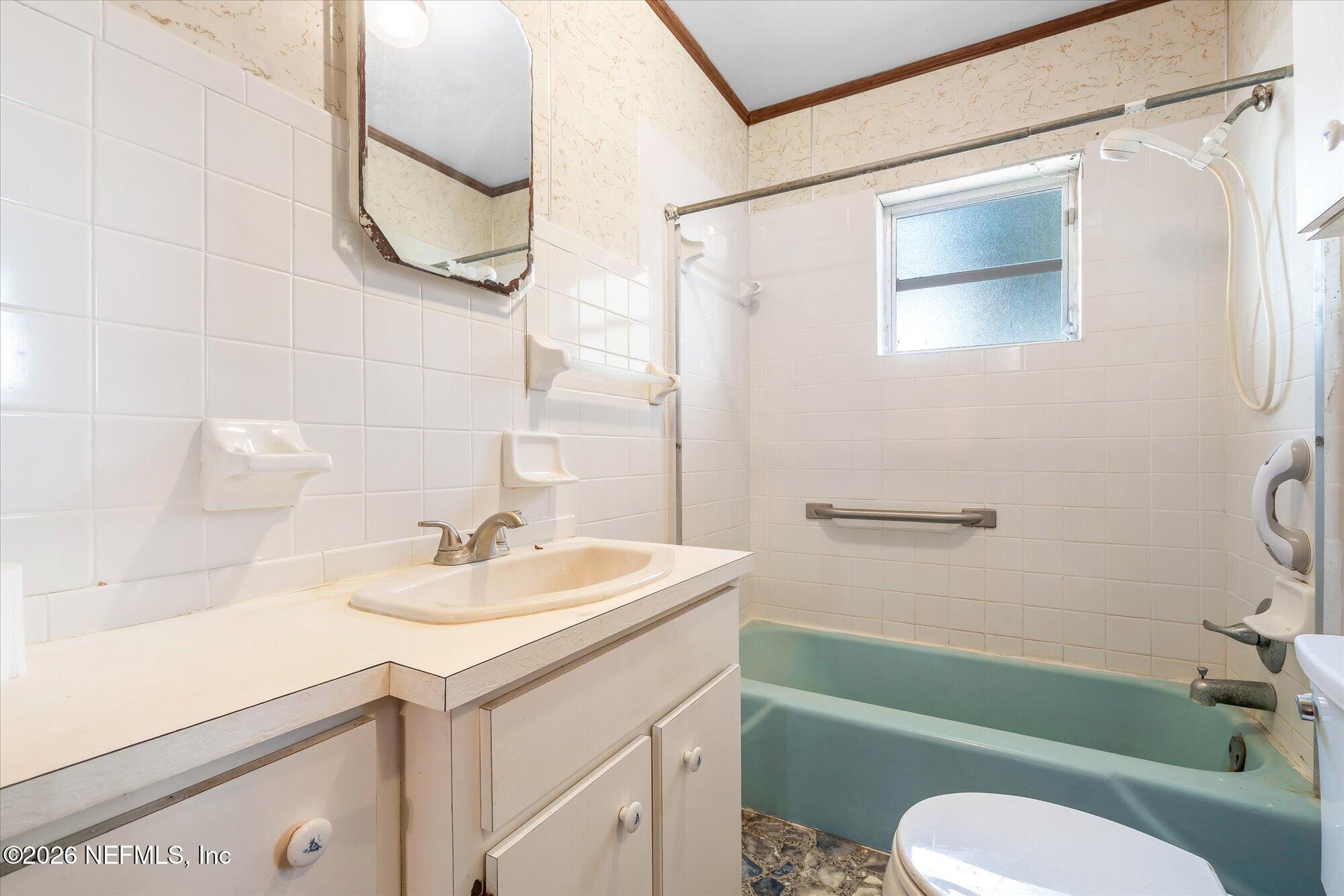 786 West River Road Palatka, FL 32177 - Photo 21 of 53 a bathroom with a sink toilet and a mirror