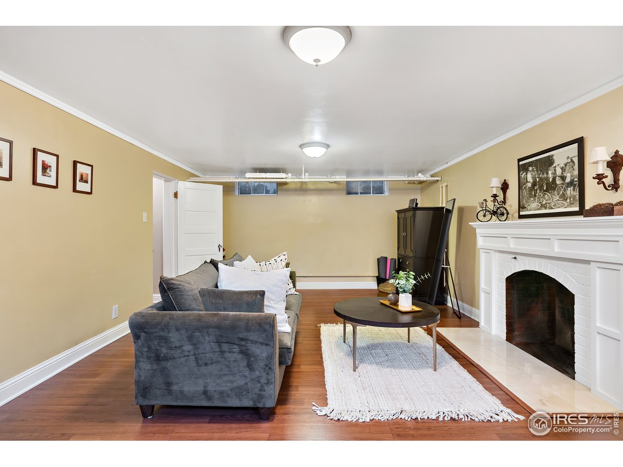 1403 Baseline Road, Unit A&B Boulder, CO 80302 - Photo 36 of 39 spacious lower-level multi-purpose room with fireplace and access to 1/2 bath