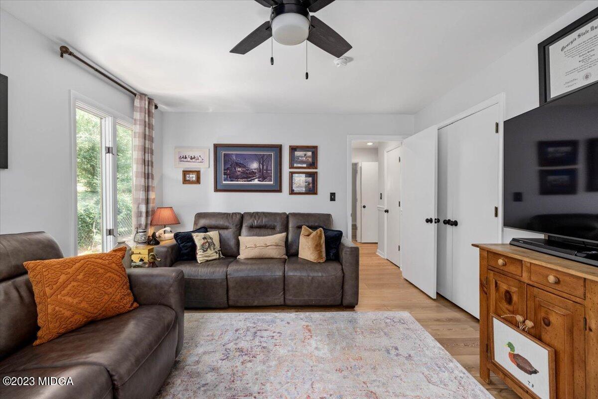 724 Forest Hill Road Macon, GA 31210 - Photo 19 of 46 a living room with furniture and a flat screen tv