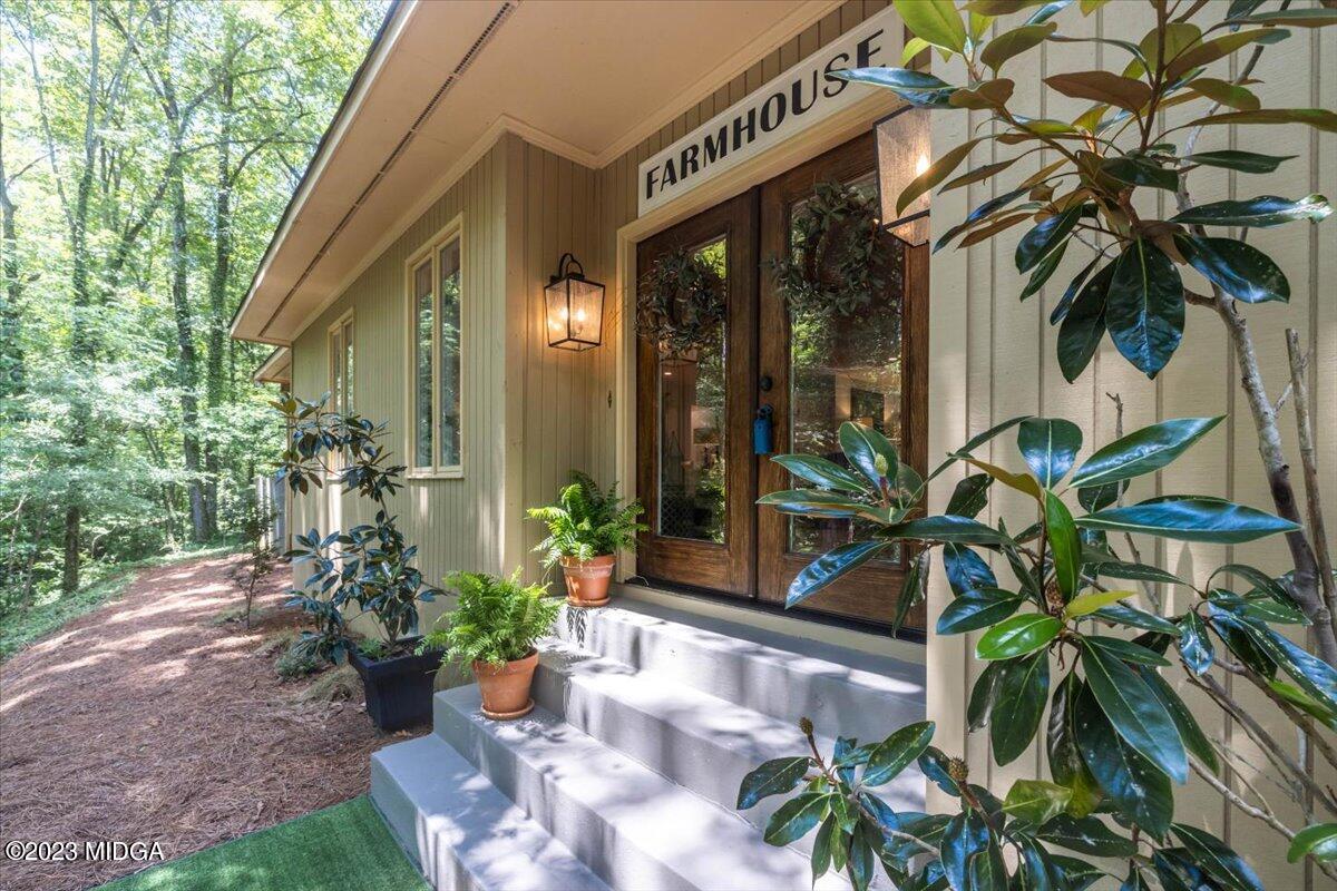 724 Forest Hill Road Macon, GA 31210 - Photo 2 of 46 a view of a potted plants in front of house