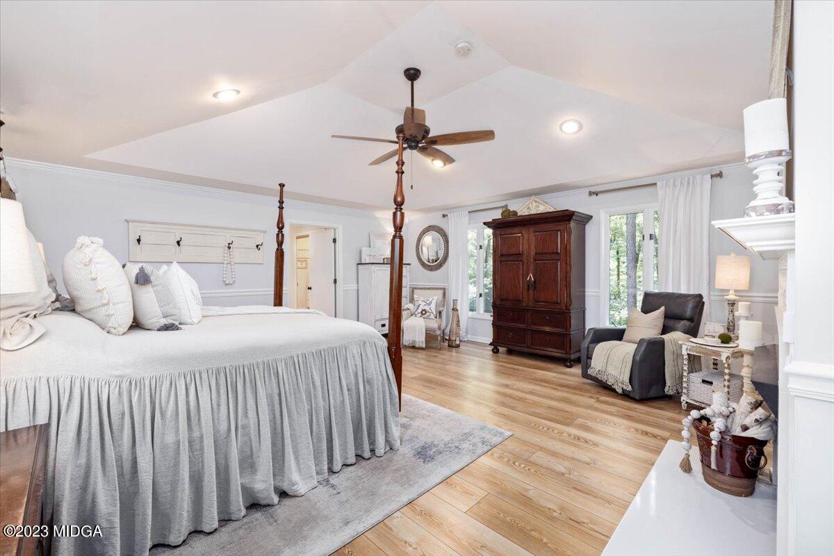 724 Forest Hill Road Macon, GA 31210 - Photo 25 of 46 a bedroom with a bed and wooden floor