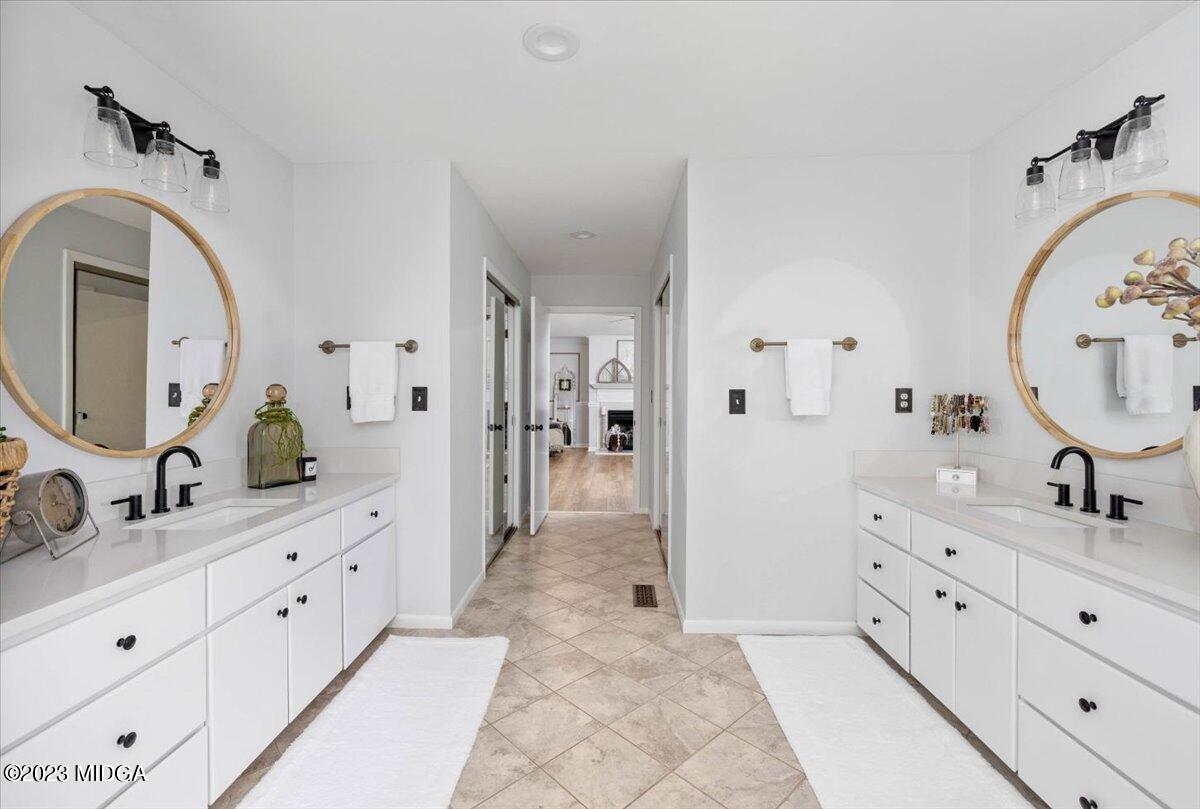 724 Forest Hill Road Macon, GA 31210 - Photo 28 of 46 a spacious bathroom with a double vanity sink mirror and shower